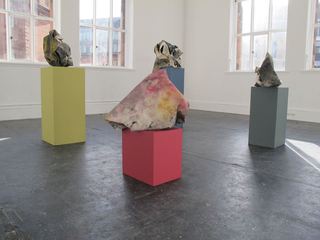 Bunches on corresponding coloured plinths.
