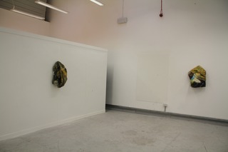 4ft square canvas with ready mix paint, charcoal, plaster then bunched up and hung with a drawing pin.