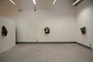 4ft square canvas with ready mix paint, charcoal, plaster then bunched up and hung with a drawing pin.