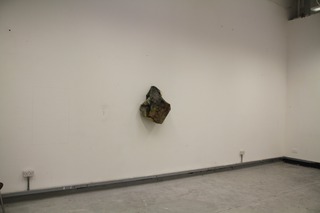 4ft square canvas with ready mix paint, charcoal, plaster then bunched up and hung with a drawing pin.