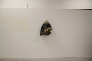 4ft square canvas with ready mix paint, charcoal, plaster then bunched up and hung with a drawing pin.