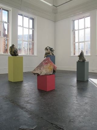 Bunches on corresponding coloured plinths.