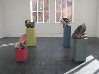 Bunches on corresponding coloured plinths.