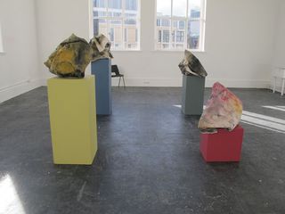 Bunches on corresponding coloured plinths.
