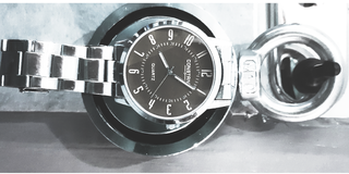 A black and white picture of a watch. It is five past eight. We don’t know if it is the morning or the evening. Time isn’t the same as it used to be. 